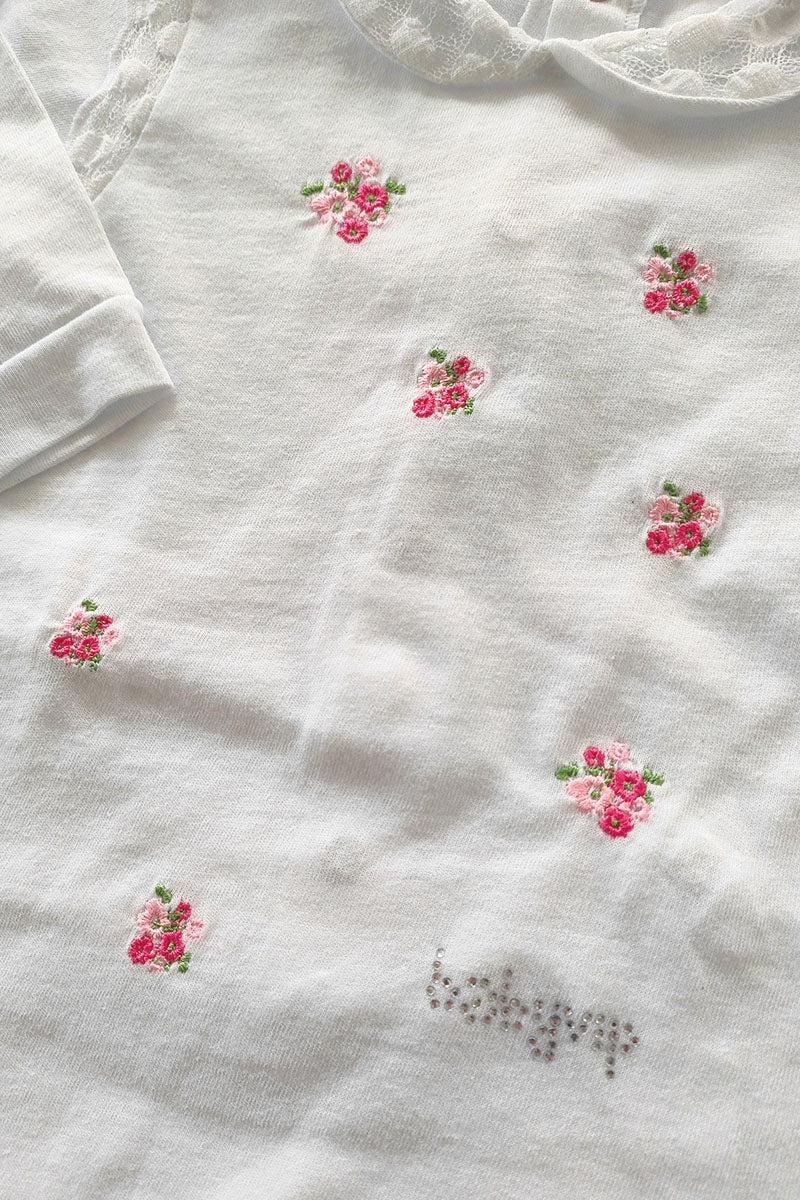 Tutina in cotone jersey con ricamo fiori e inserti in pizzo + strass
