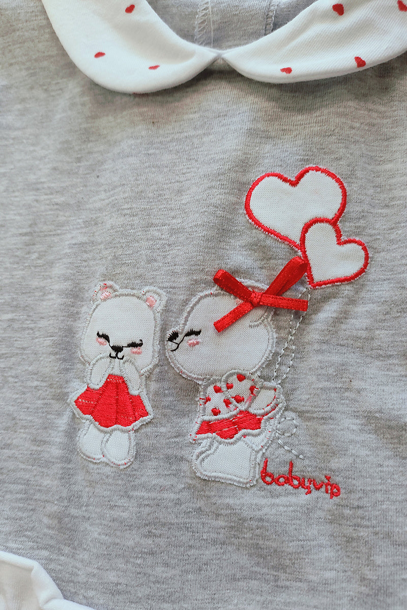 Pagliaccetto in cotone elasticizzato con fantasia pois a cuori e ricamo