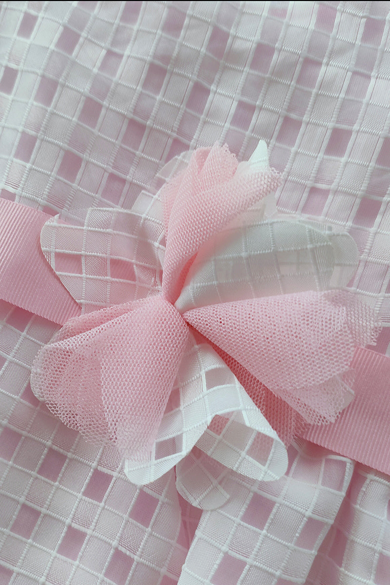 Pagliaccetto in tela di cotone rivestito in organza quadrettata con nastro in gros grain e rosa applicata