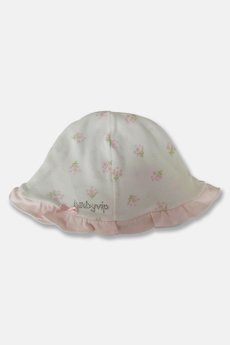 Cappellino in cotone con rouches fiocchettino e scritta in strass