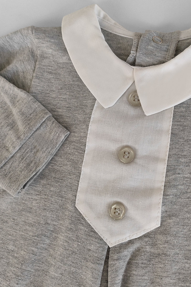 Tutina in cotone elasticizzato con inserti in tela di cotone e bottoncini