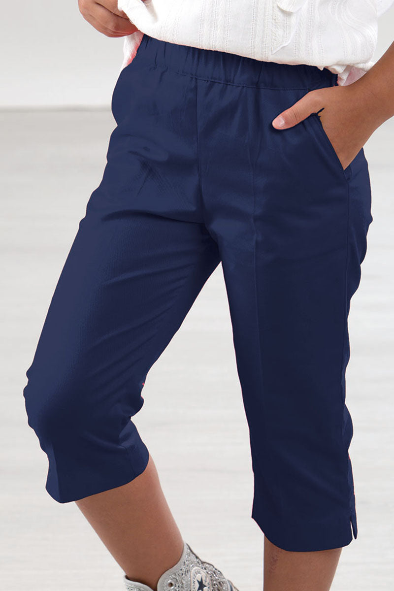 Pantalone modello capri in tela di cotone con tasche e spacchetti sul fondo
