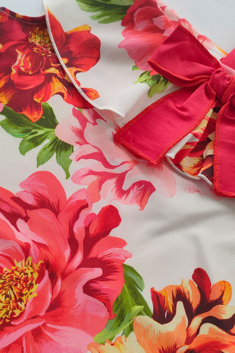 Vestitino monospalla in crepe fantasia floreale con bretella in contrasto e balza