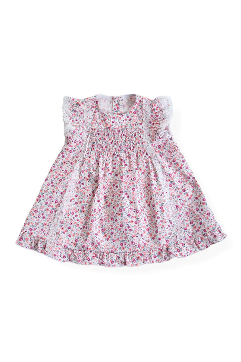 Vestitino in tela di cotone organico fantasia provenzale con punto smock, pizzetto applicato e balza sul fondo