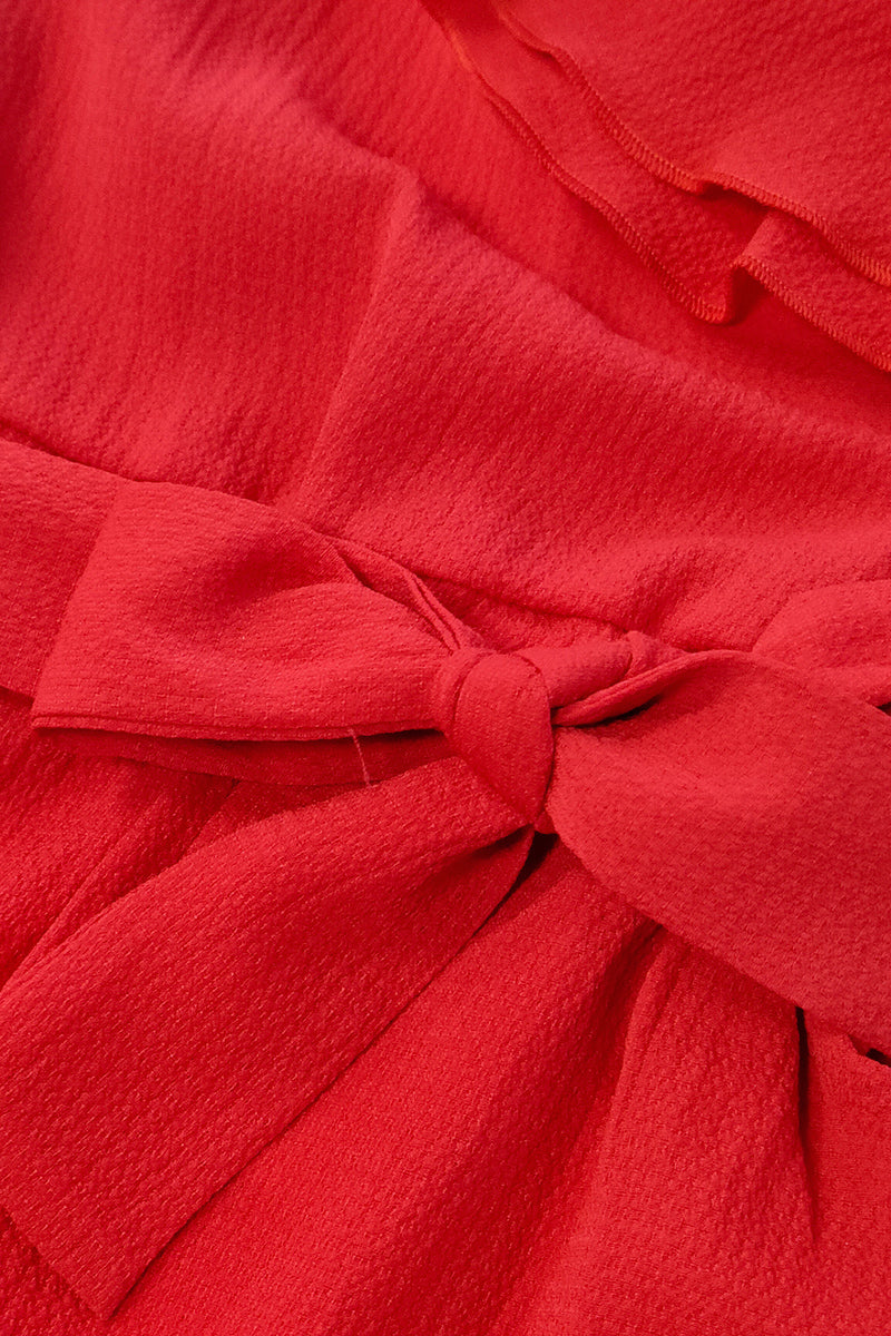 Jumpsuit monospalla in crepe con balze e cintura in tessuto