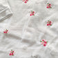 Tutina in cotone jersey con ricamo fiori e inserti in pizzo + strass
