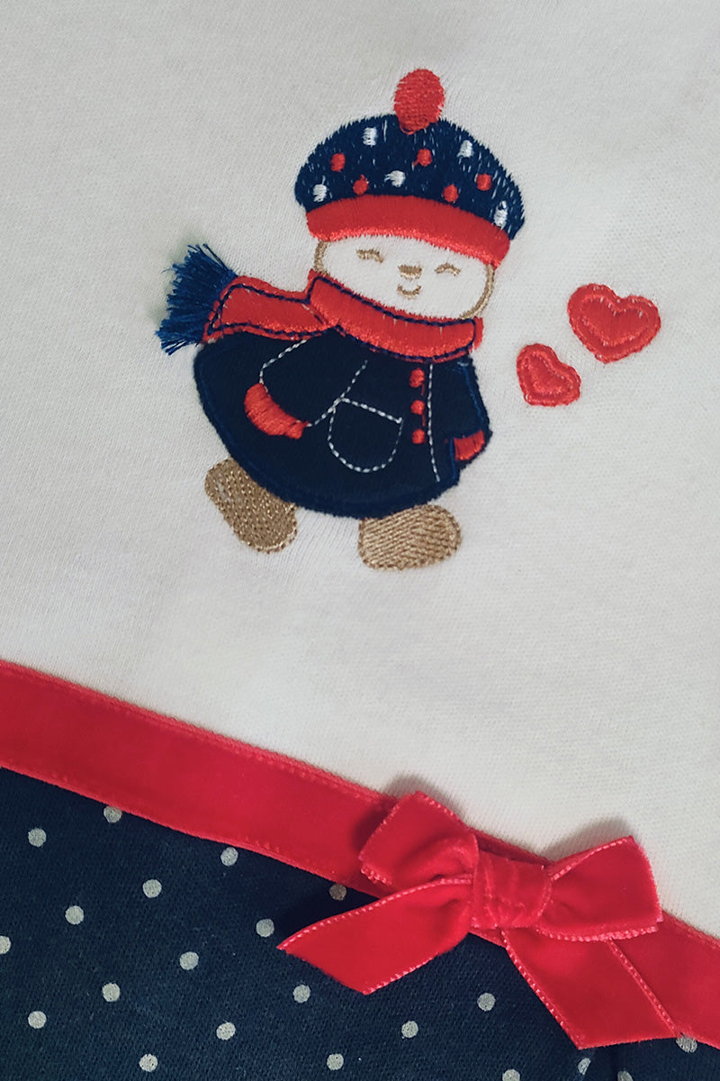 Tutina in caldo cotone fantasia pois con applicazione ricamata e fiocchi