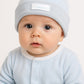 Cappellino in ciniglia con risvolto ed etichetta cucita baby vip