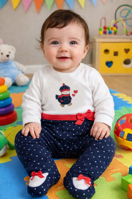 Tutina in caldo cotone fantasia pois con applicazione ricamata e fiocchi