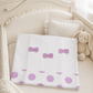 Copertina in in felpa garzata con inserto a pois e fiocchi applicati