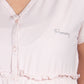 Camicia clinica aperta davanti mezza manica fantasia a pois e strass