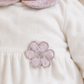 Tutina in ciniglia con applicazione fiore