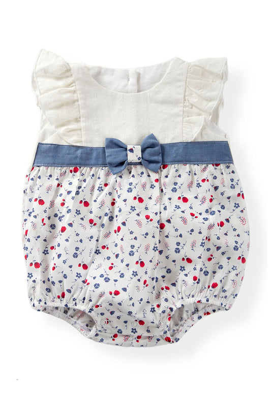 Pagliaccetto in tela di cotone operato con balze, inserto in tela fantasia floreale, fascia e fiocco in tela jeans