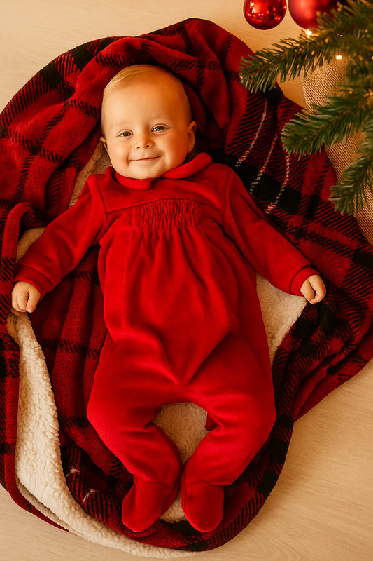 Tutina in ciniglia con taglio e punto smock