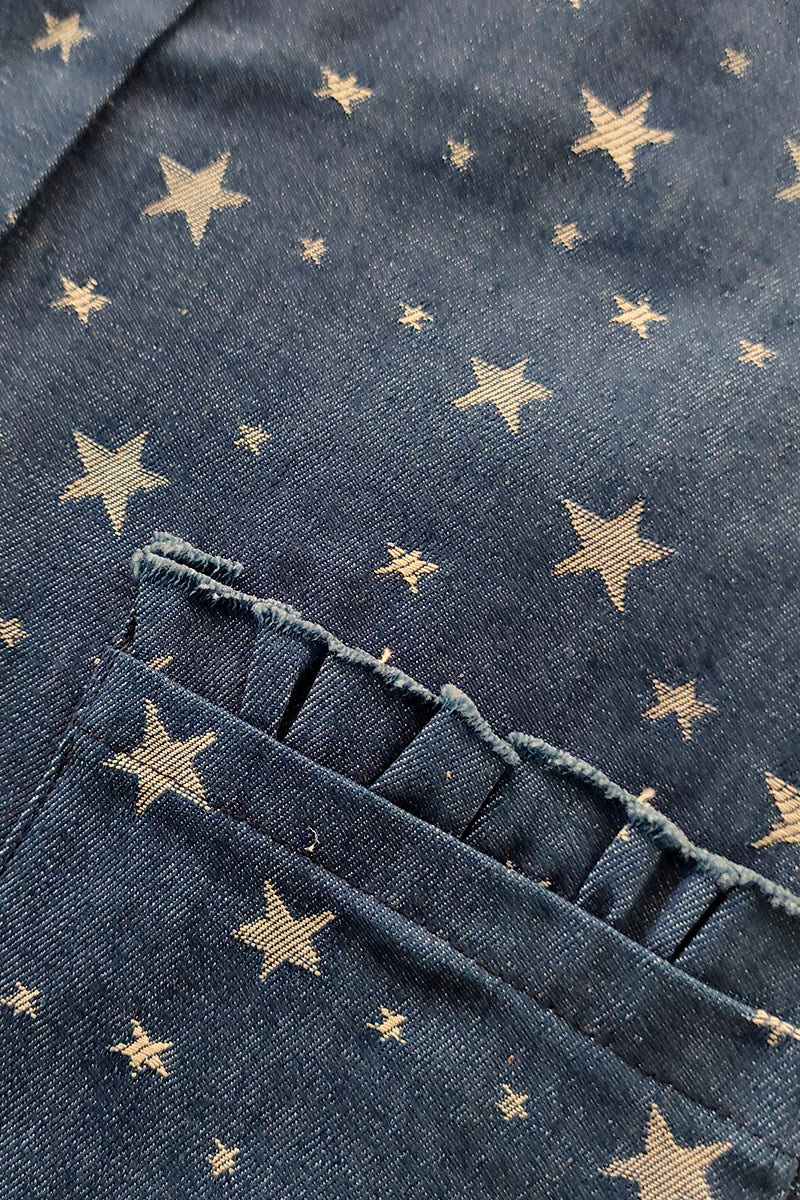 Salopette in tela jeans con fantasia stelle e tasche