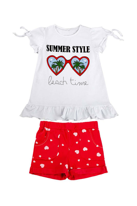 Completo mezza manica in cotone elasticizzato con stampa, balza e shorts fantasia cuori con tasche e risvolti