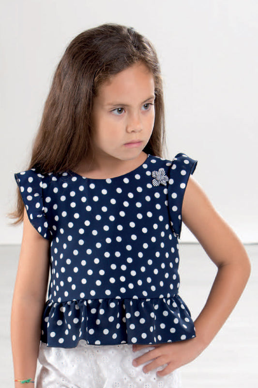Blusa crepe a pois con balza ed alette arricciate, applicazione e retro con scollatura a “v” e fiocco applicato