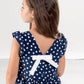 Blusa crepe a pois con balza ed alette arricciate, applicazione e retro con scollatura a “v” e fiocco applicato