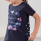 Completo in cotone elasticizzato con stampa ed inserto a pois con pinocchietto a pois