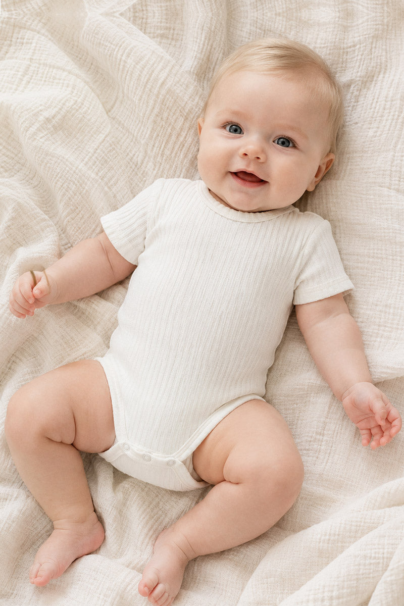 Body neonato in cotone a mezza manica