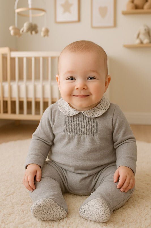 Tutina in caldo cotone organico con colletto fantasia floreale e taglio con punto smock