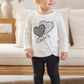 Completo in cotone elasticizzato garzato con stampa e arricciatura sul fondo laterale e leggings in contrasto